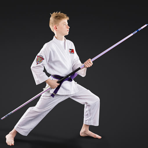 A teenage student using a staff